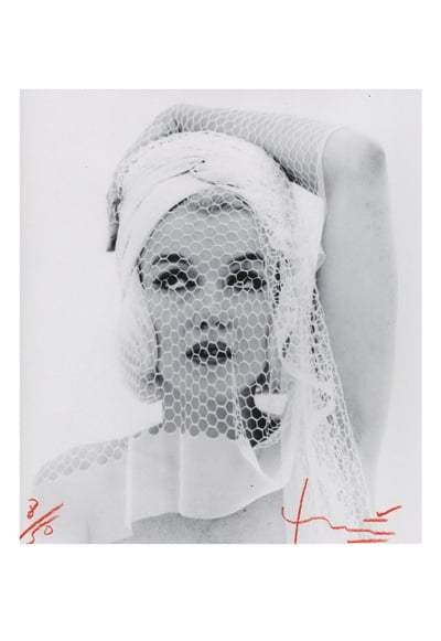 Marilyn looking up in the wedding veil